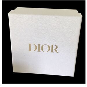 DIOR WHITE AND GOLD LETTERS.